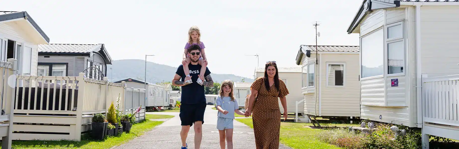 Family walking the grounds of Lido Beach Holiday Park