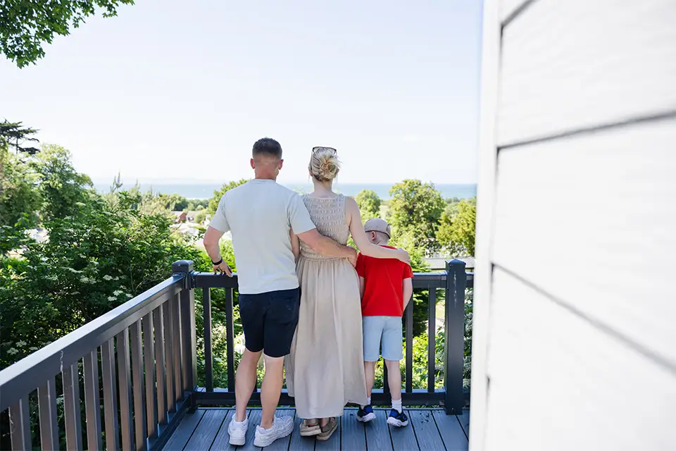Family overlooking their new static caravan for sale in Conwy